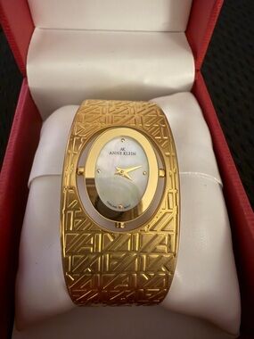 Anne Klein Gold-Tone Textured Bangle Watch with Mother-of-Pearl Dial